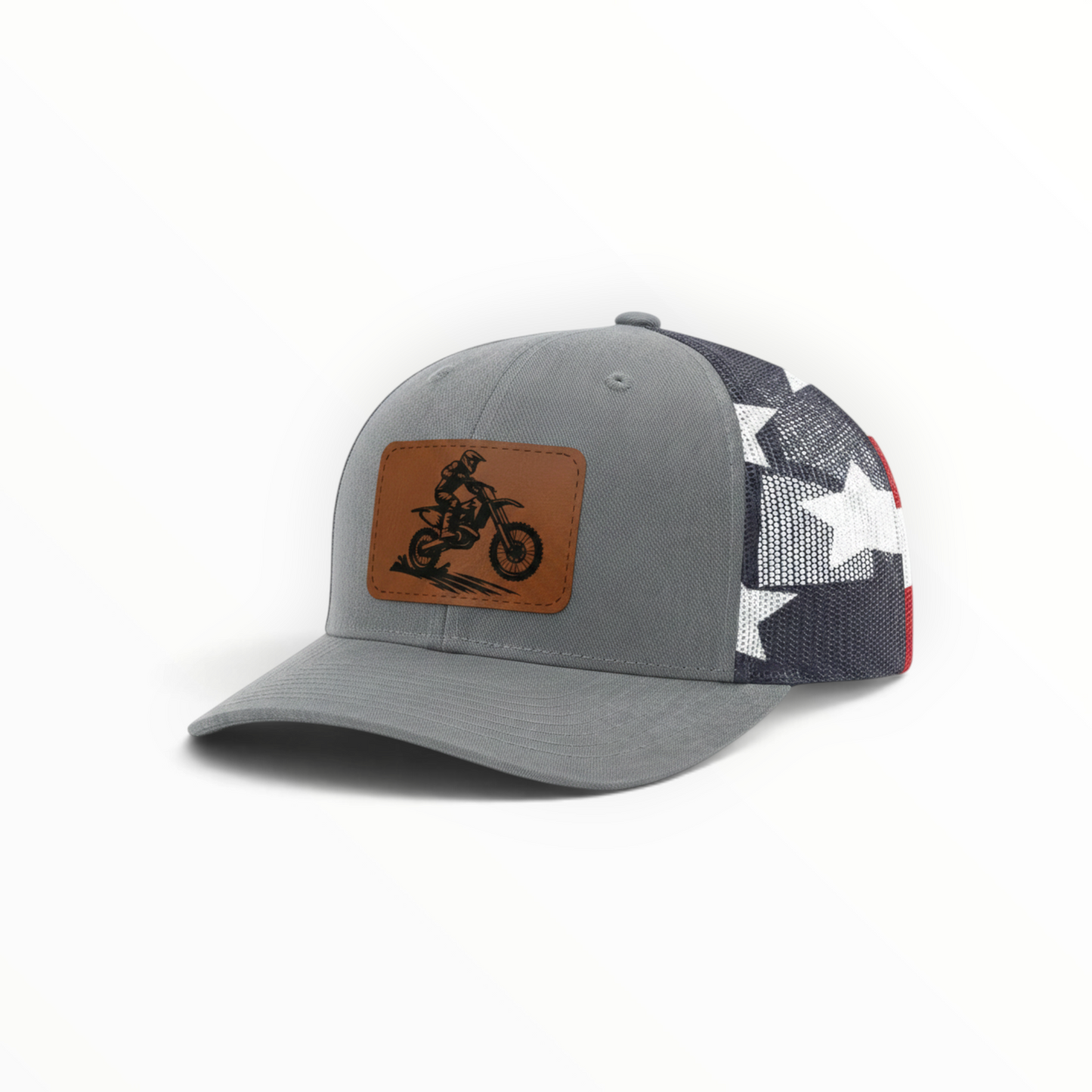 Gray trucker hat with dirt bike patch, side mesh shows white star shapes
