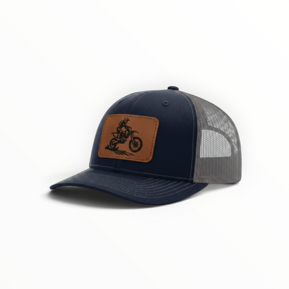 Navy trucker hat with dirt bike patch, dark mesh side panel