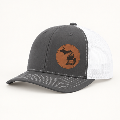 Charcoal trucker hat with tan fishing patch and white mesh side panels