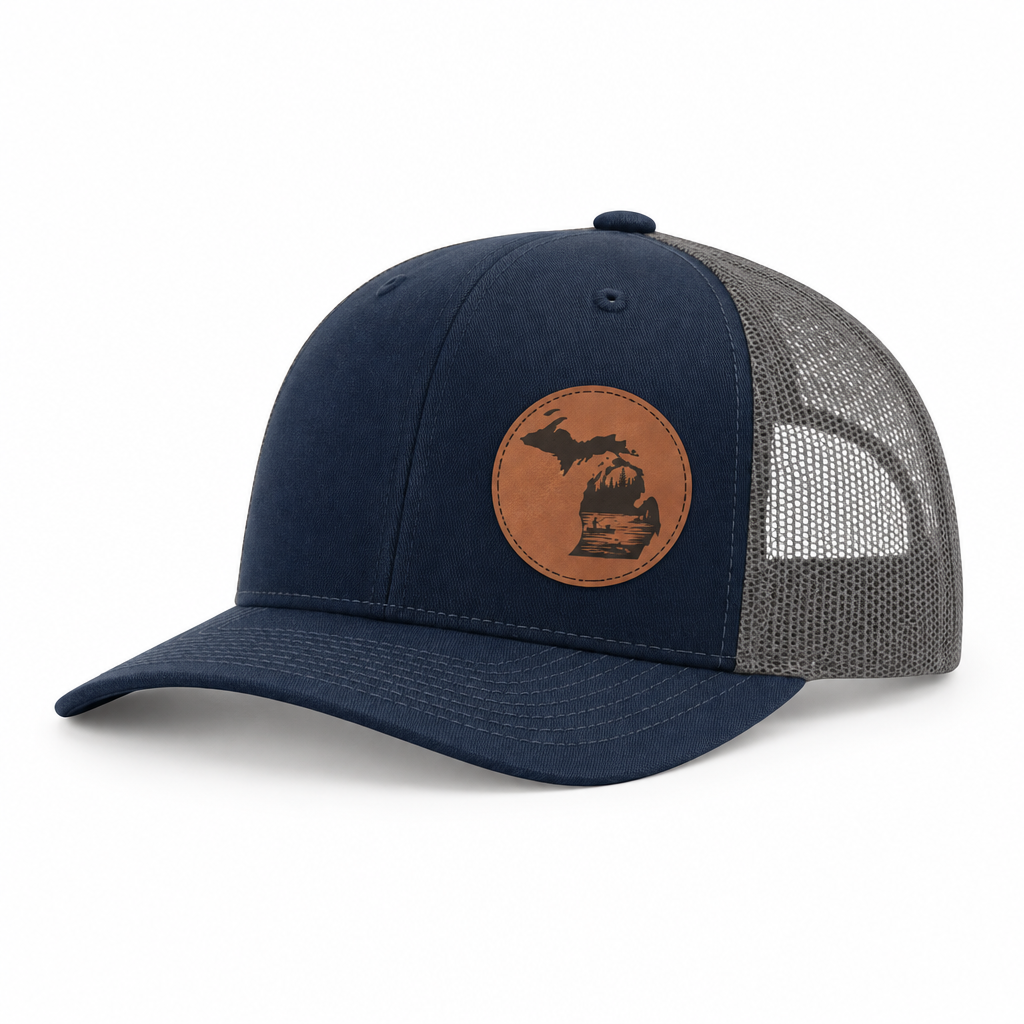 Navy trucker hat with tan fishing patch and gray mesh side panels