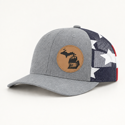 Gray trucker hat with tan fishing patch and black/white checkered mesh side panels