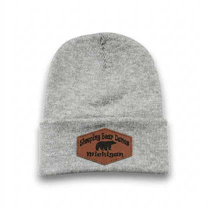 Dark heather grey knit beanie with Sleeping Bear Dunes Michigan logo patch
