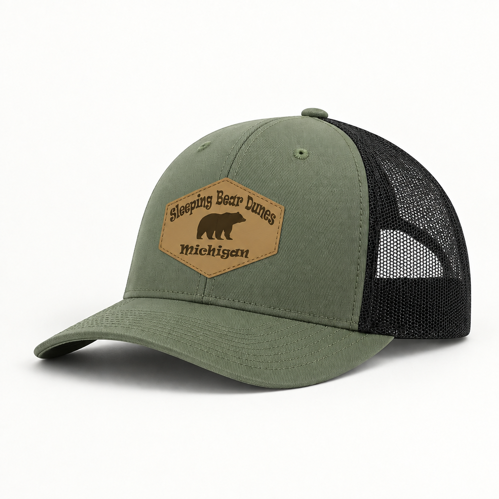Olive green trucker hat with black mesh sides and tan Sleeping Bear Dunes Michigan patch