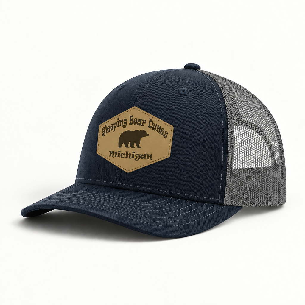 Navy and gray trucker hat with mesh sides and tan Sleeping Bear Dunes Michigan patch