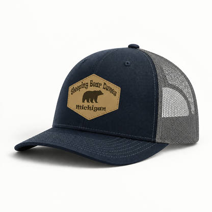 Navy and gray trucker hat with mesh sides and tan Sleeping Bear Dunes Michigan patch