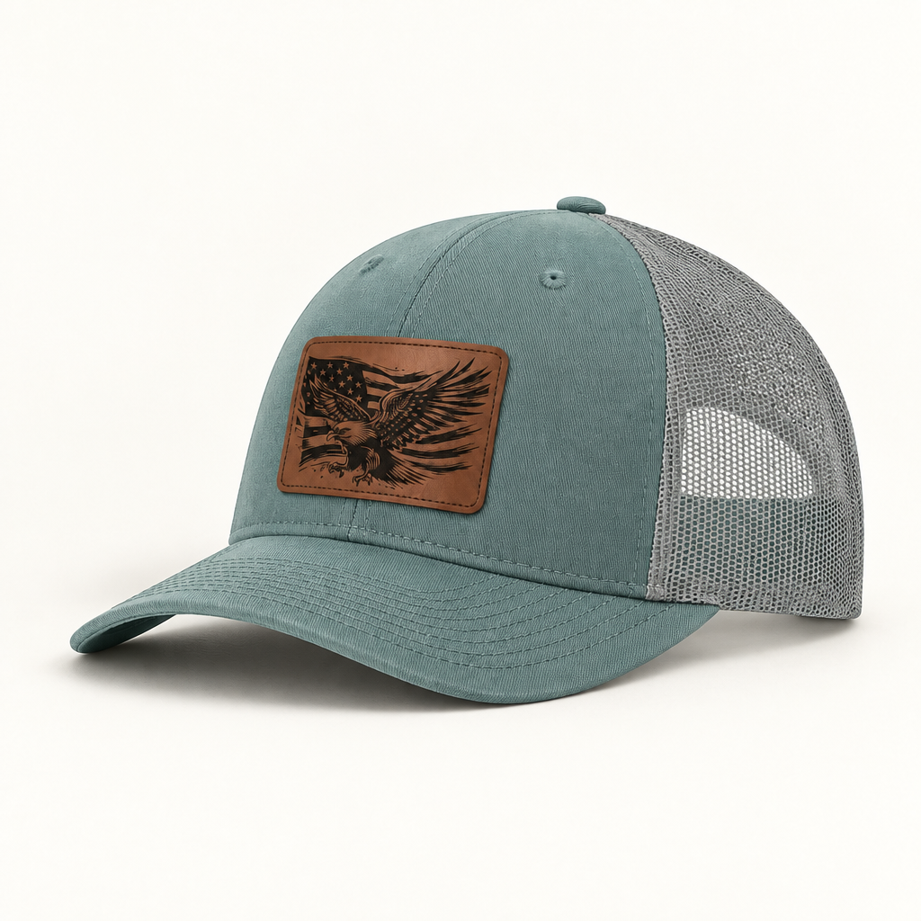 Light teal trucker hat with eagle American flag patch and grey mesh side panels