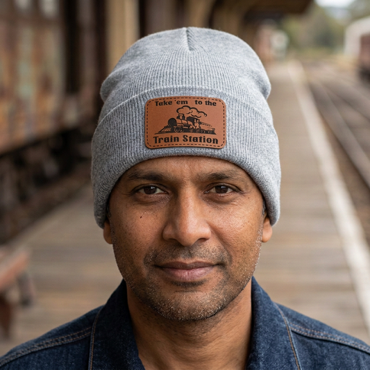Heather grey knit beanie worn by man with Train Station patch on front cuff